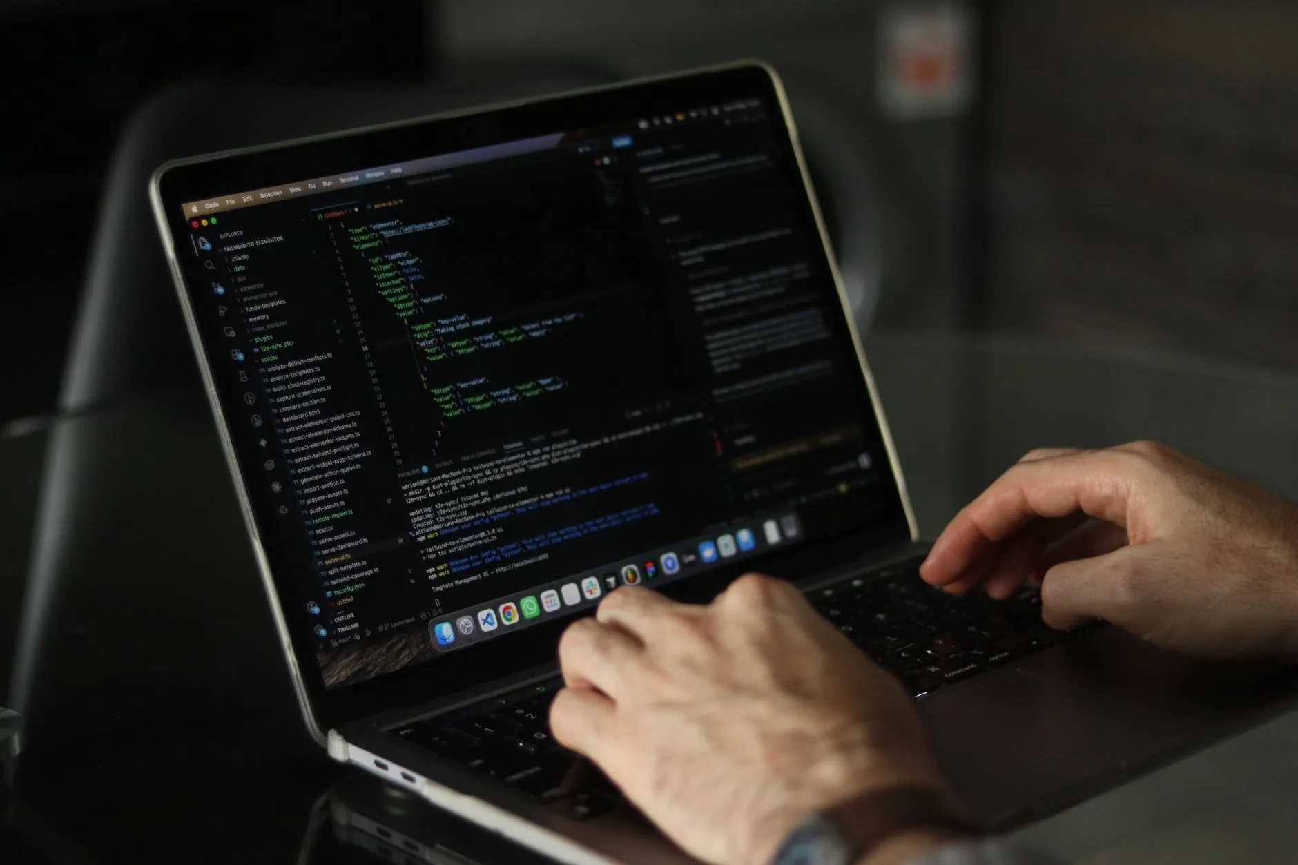 Scientist in lab coat analyzing graph computing data for particle simulation models.