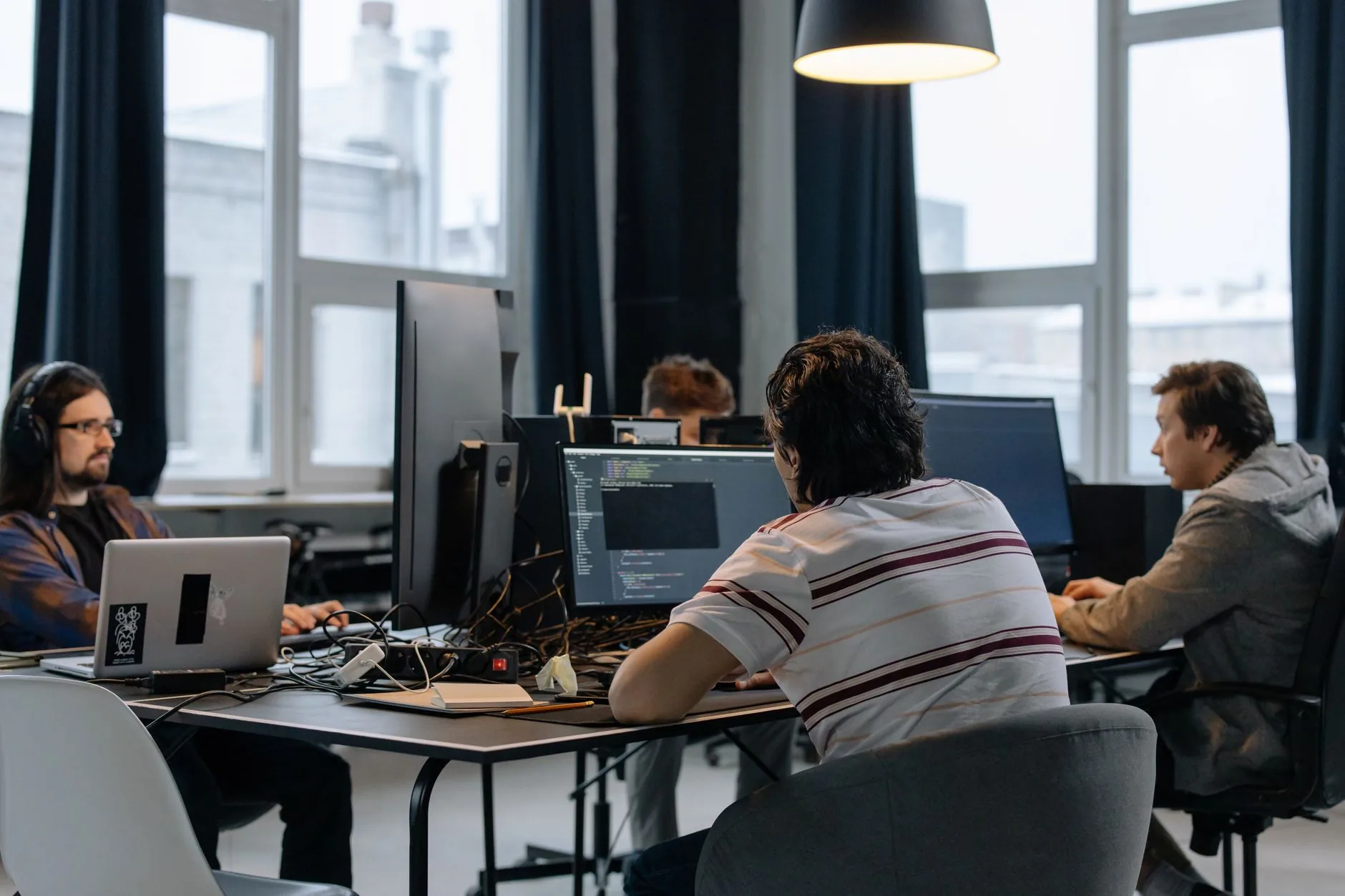 Person at desk with vintage CRT monitor, muted colors, soft lighting, understanding beta context.